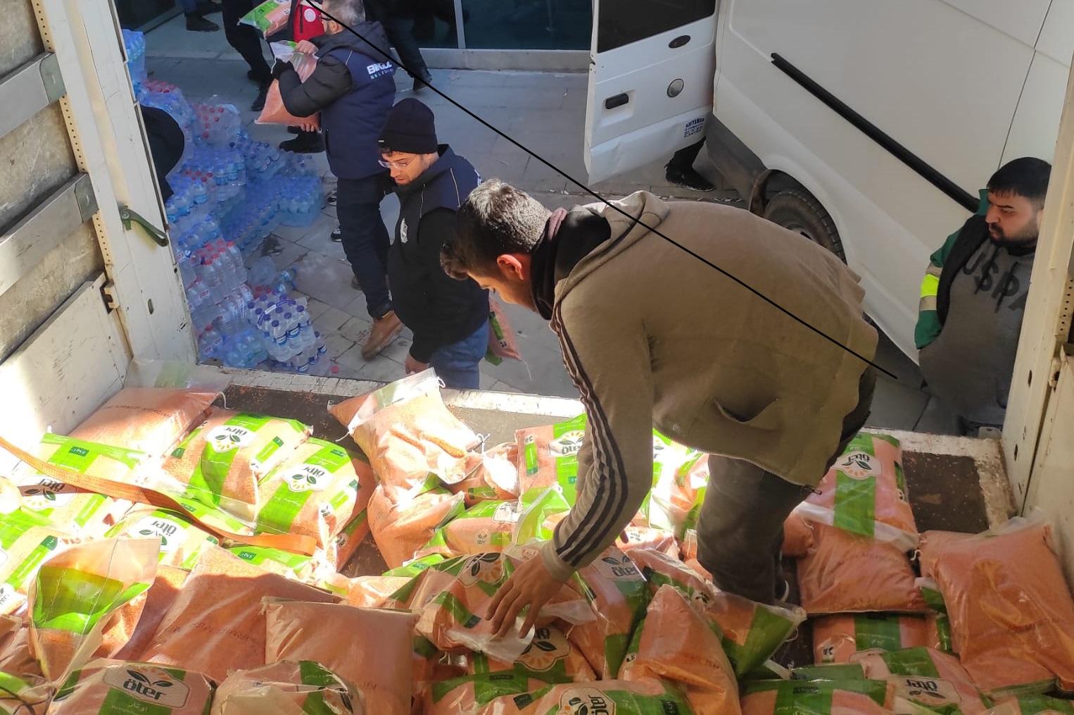 Volunteers distribute donations from local businesses.