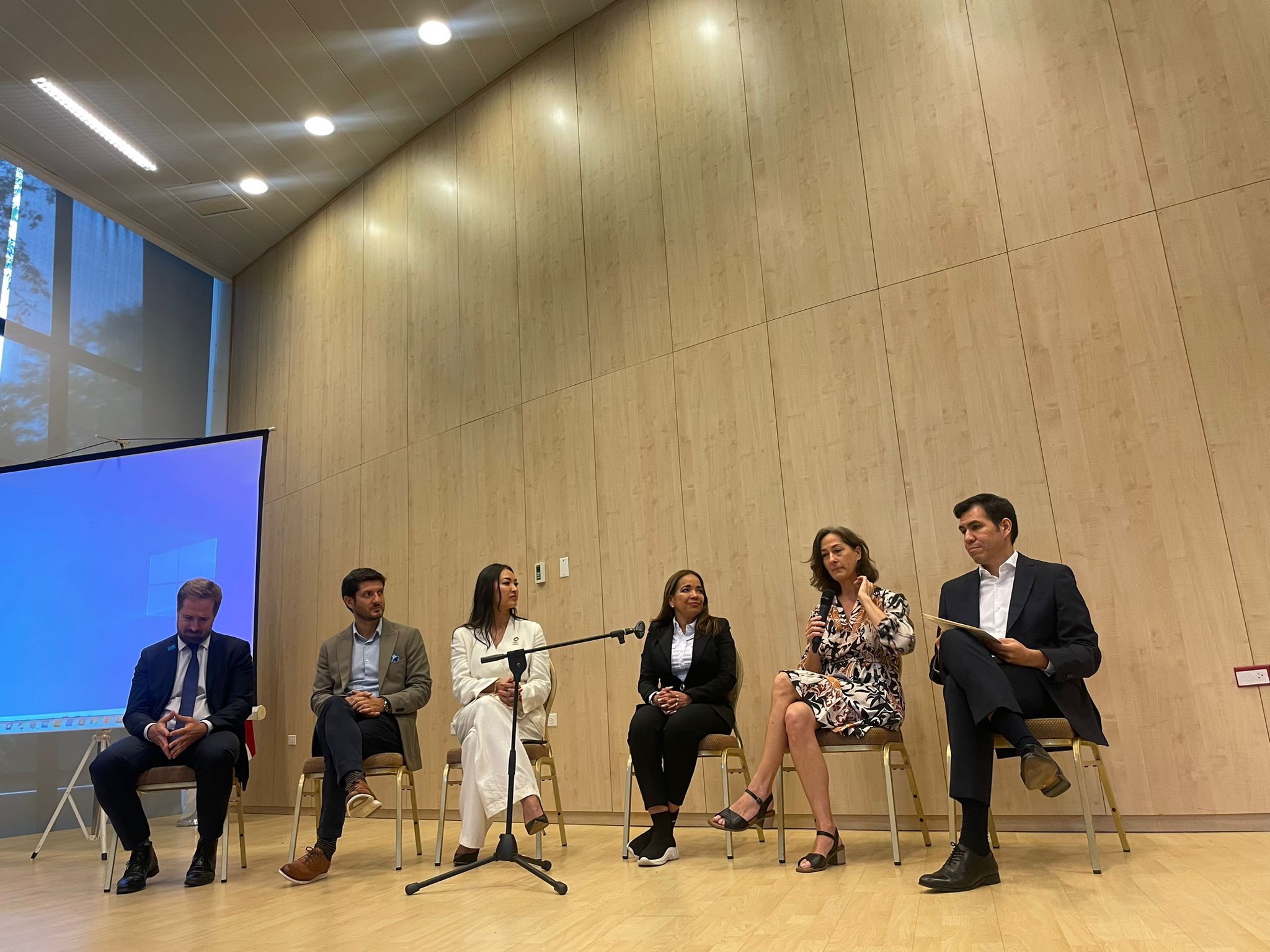 Six panelists sit on stage as part of the Public Private Partnership Forum on Private Sector Engagement and Strengthening CEPREDENAC's Regional Mechanism for Disaster Response