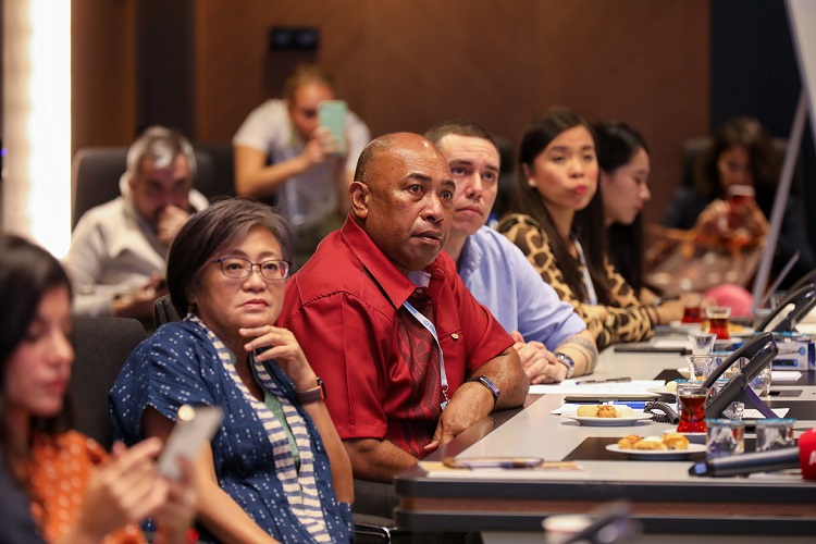 Participants listen attentively to the presentation given by Mr. Osman of AKOM