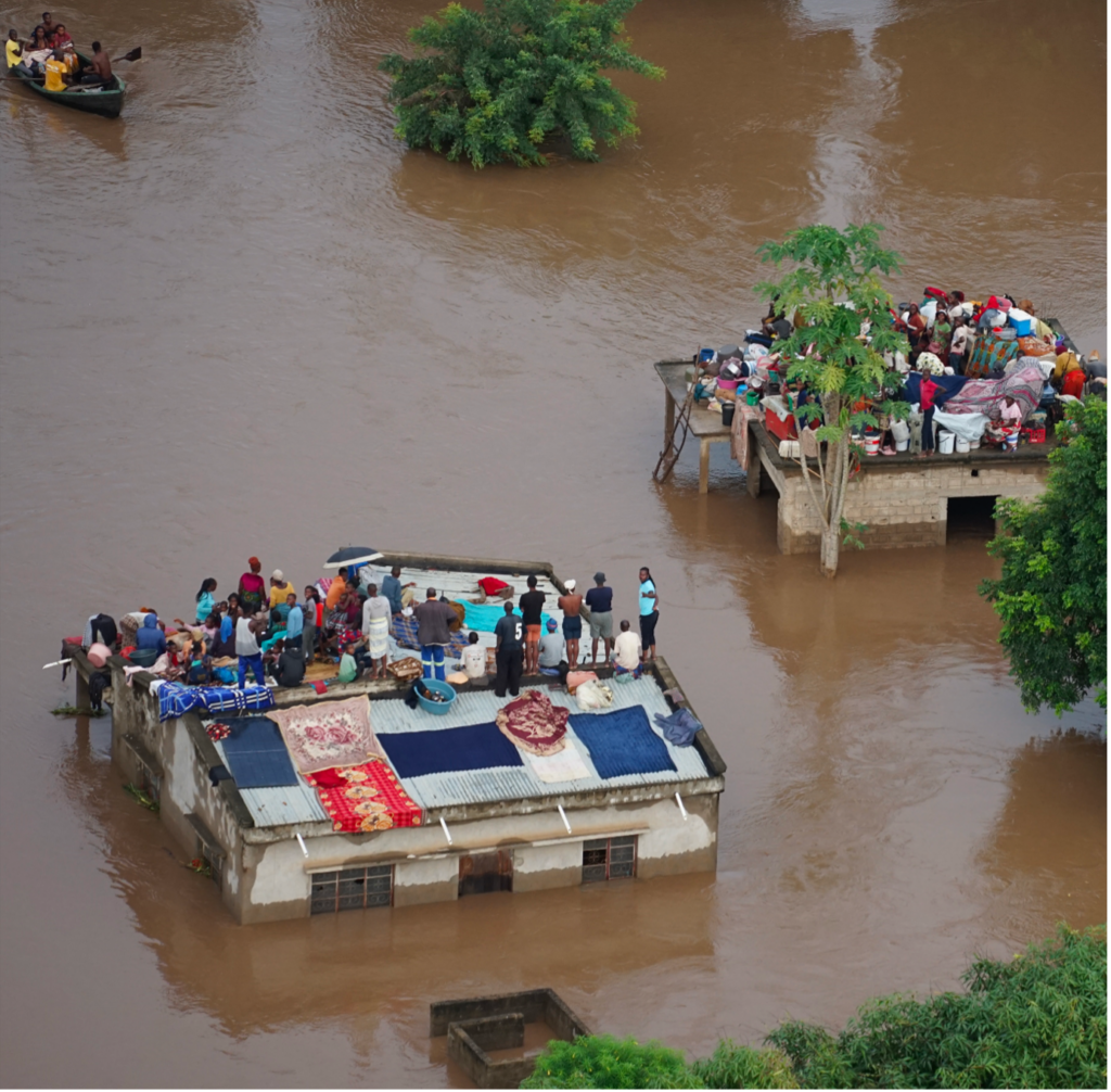 People stranded on top of houses in the aftermath of the floods in Mozambique, January 2026. Photo: Mercy Air