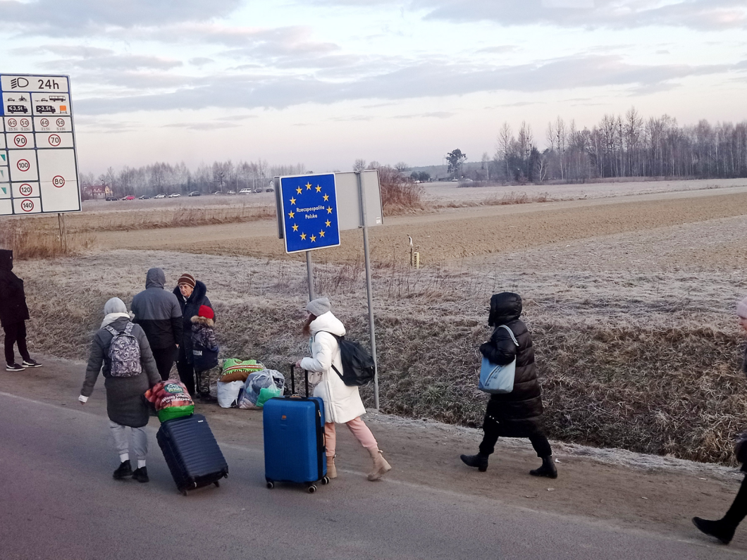 People cross the border from Ukraine into Poland on 27 February 2022