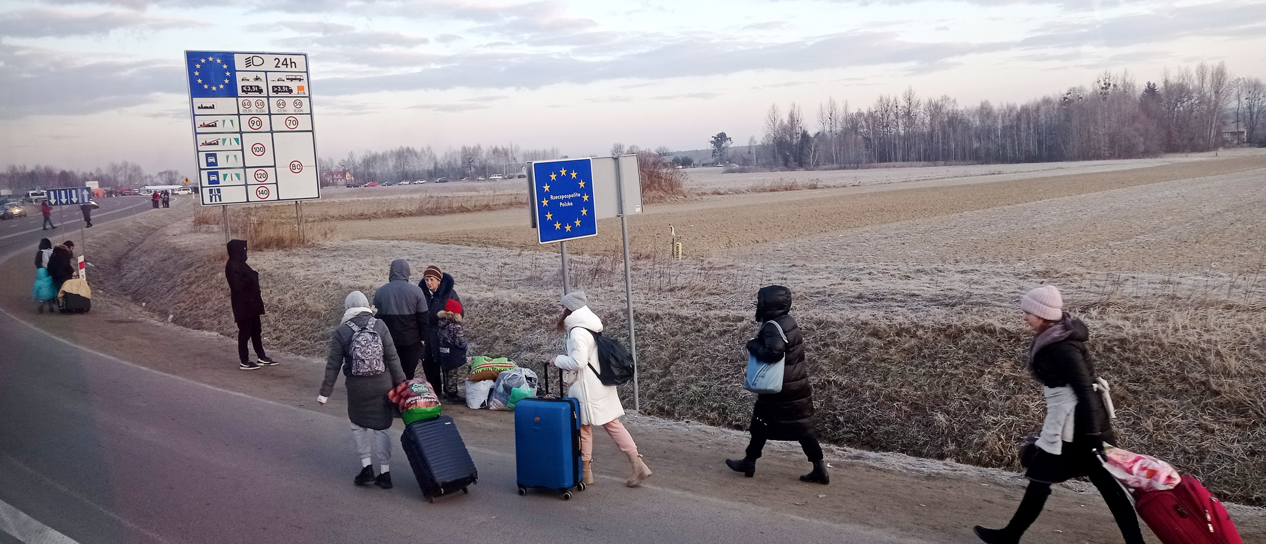 People cross the border from Ukraine into Poland on 27 February 2022