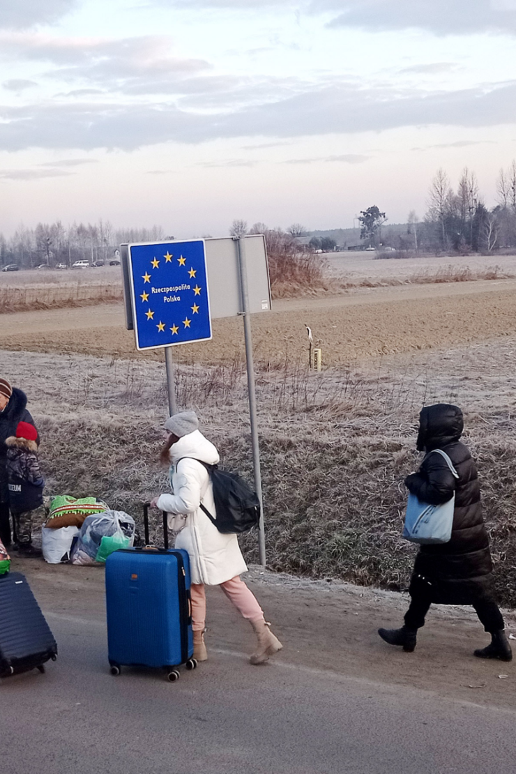 People cross the border from Ukraine into Poland on 27 February 2022