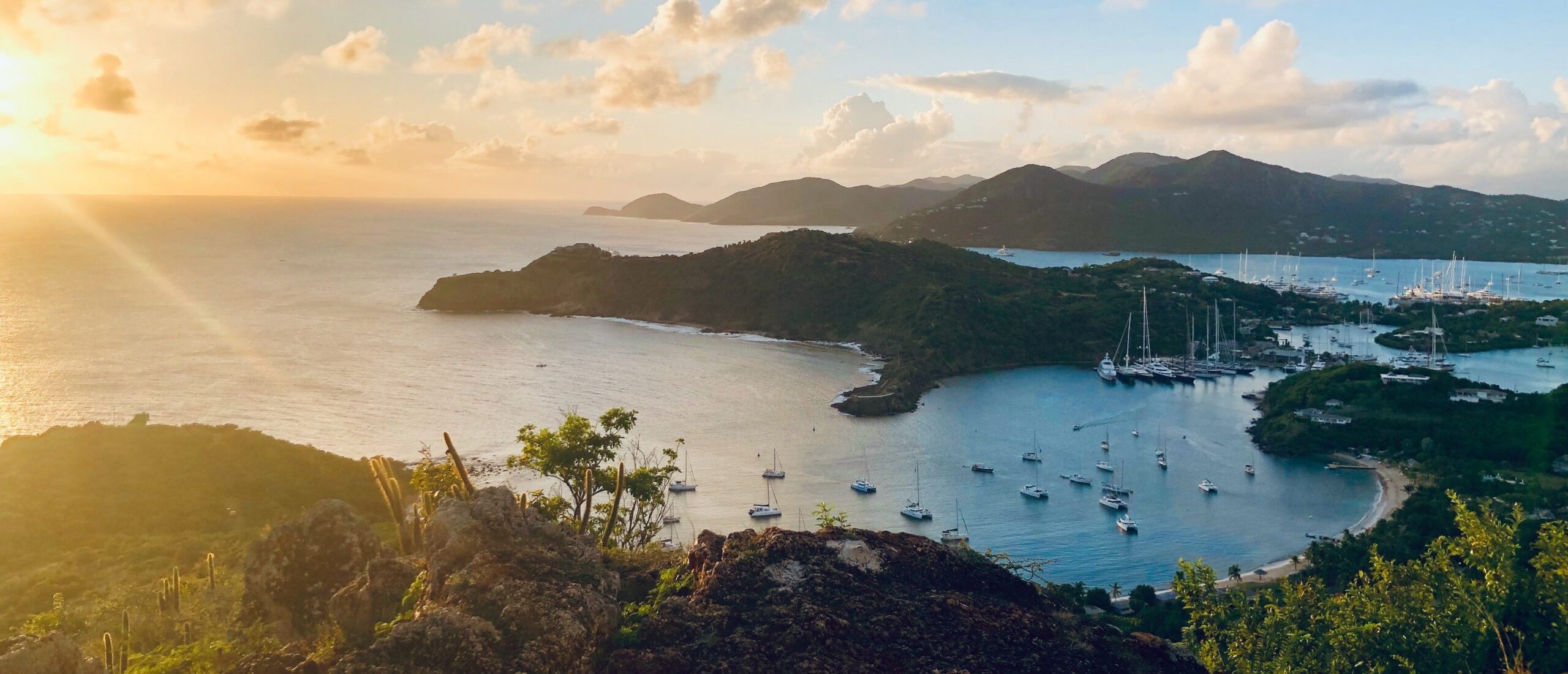 A sunset over a Caribbean island