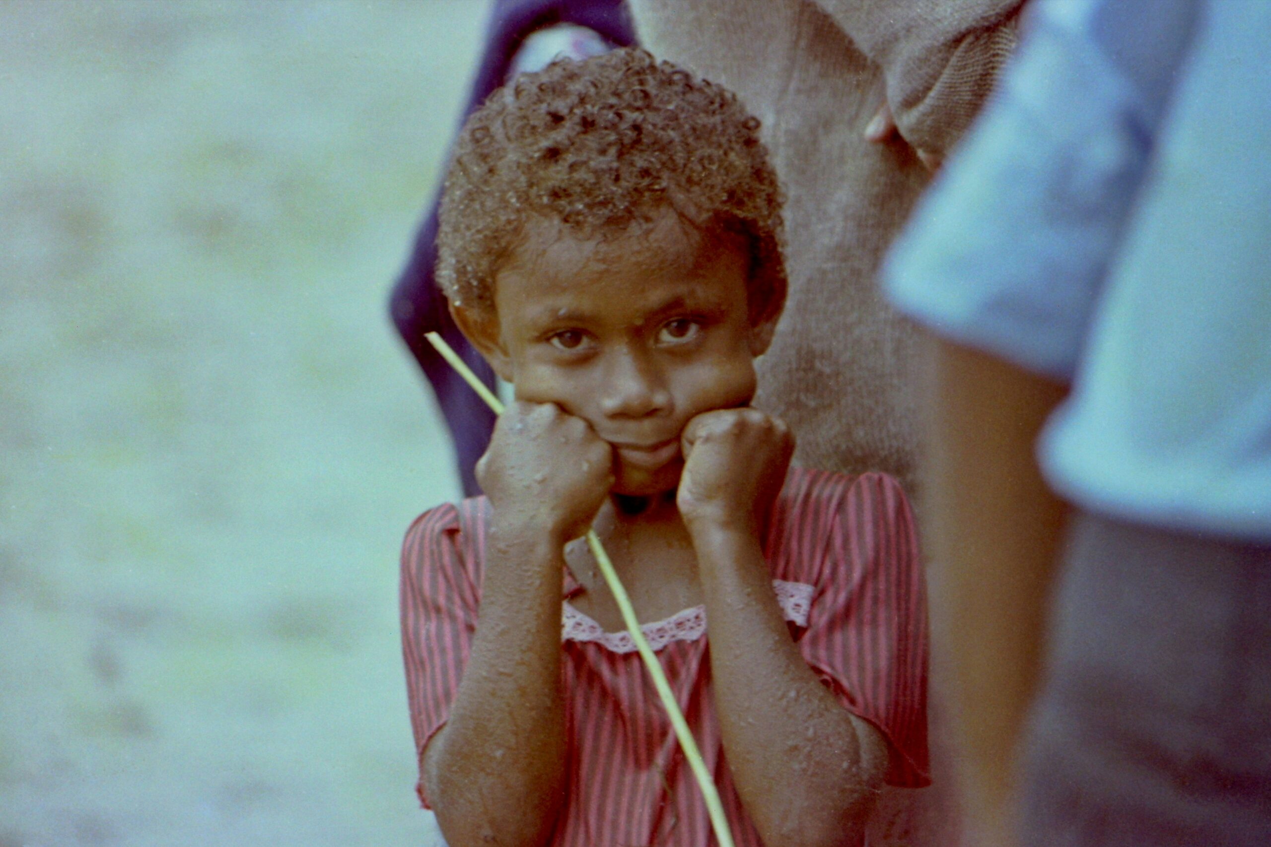 Girl in the rain in Suva, Fiji. Photo by Bill Fairs via Unsplash.
